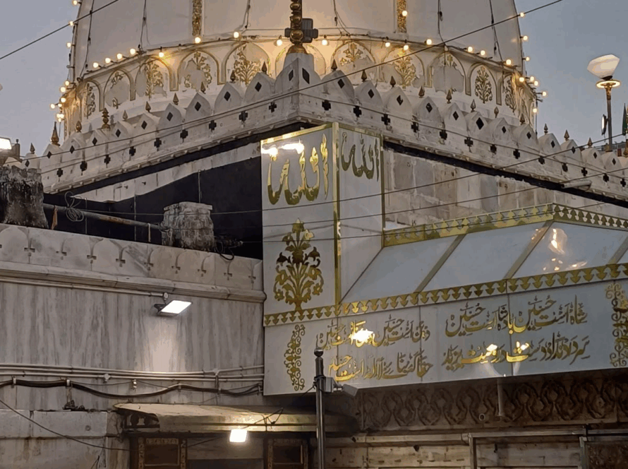 Ajmer Sharif Dargah with its illuminated dome and visiting devotees, a spiritual highlight among tourist places to visit in Rajasthan 