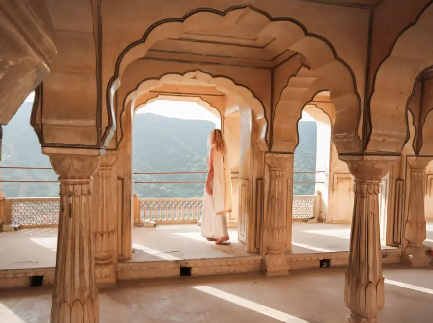A traveler admiring the view from the Amer Fort in Jaipur, India, showcasing the architectural beauty of South Asian Gems